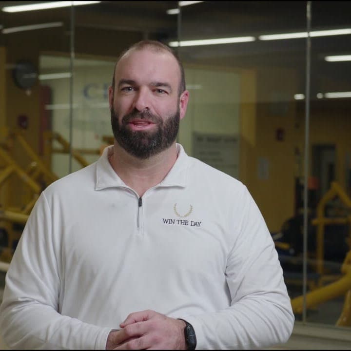 Dan Rigby of Win the Day, in a weight room.